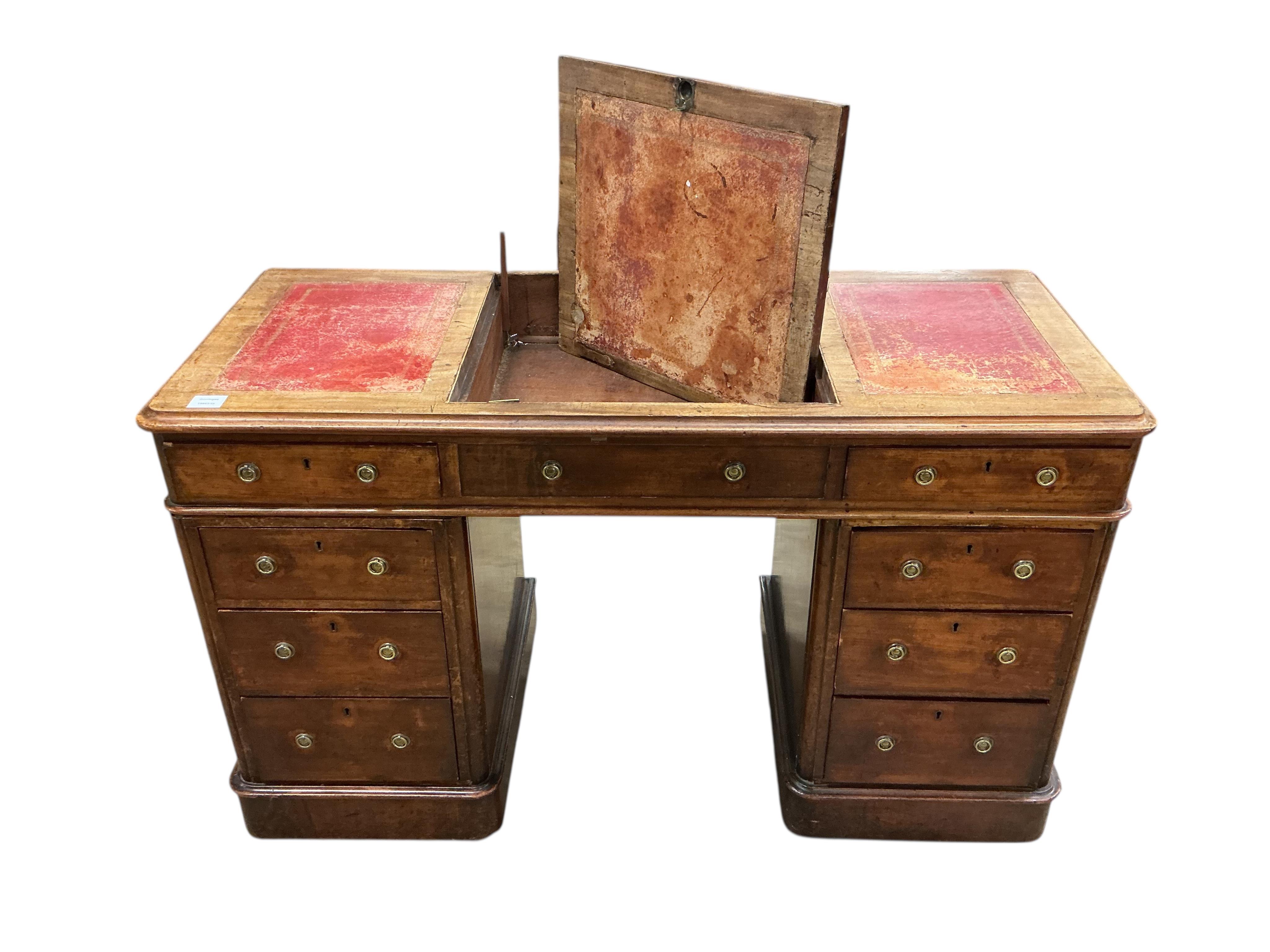 A Victorian mahogany pedestal desk, the top with hinged central section, width 122cm, depth 53cm, height 78cm